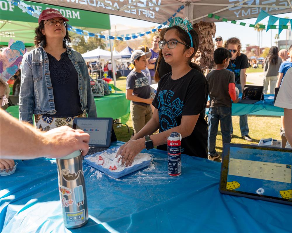 An image of a student from Weinberg Gifted Academy showcasing their science project.